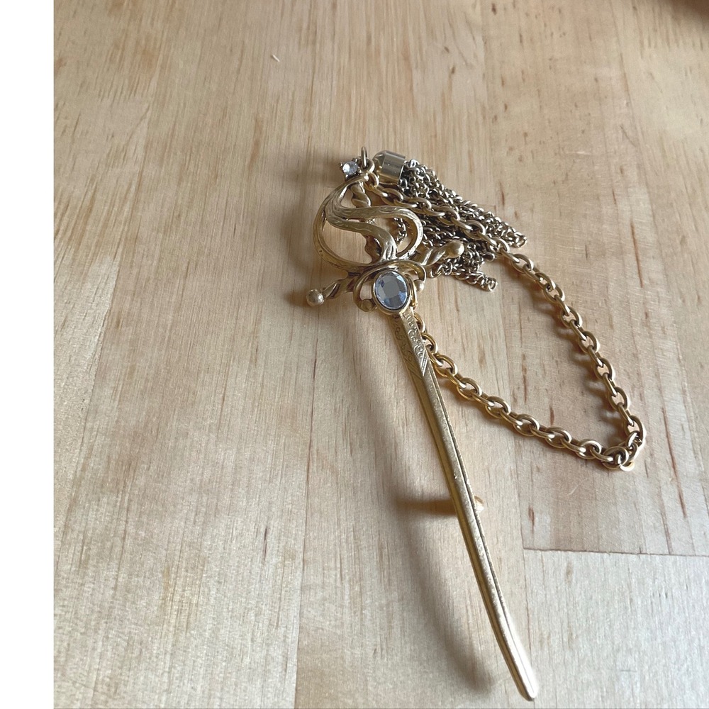 Vintage Gold Tone Sword Brooch with Blue Rhinestone Tassel and Chain Accent